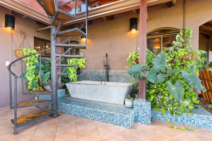 Private outdoor stone bathtub at Casa Coral