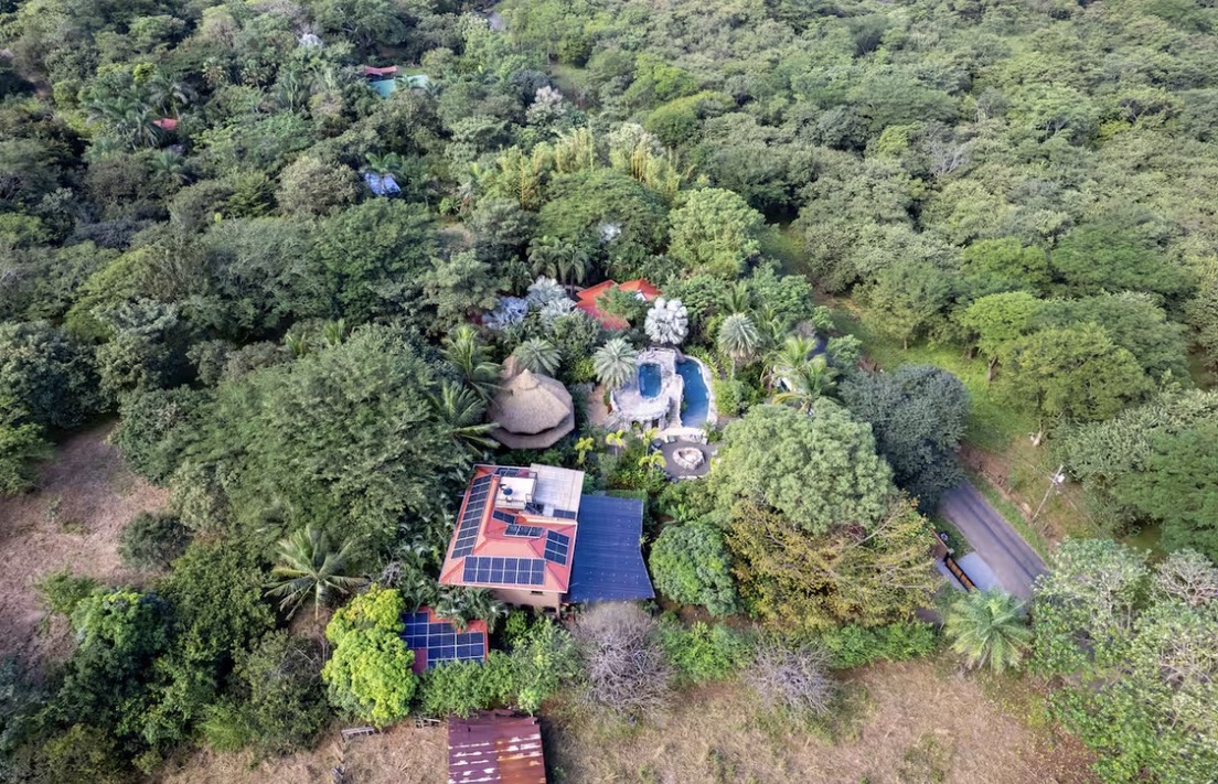 An aerial view of the boutique hotel tucked entirely within the jungle canopy